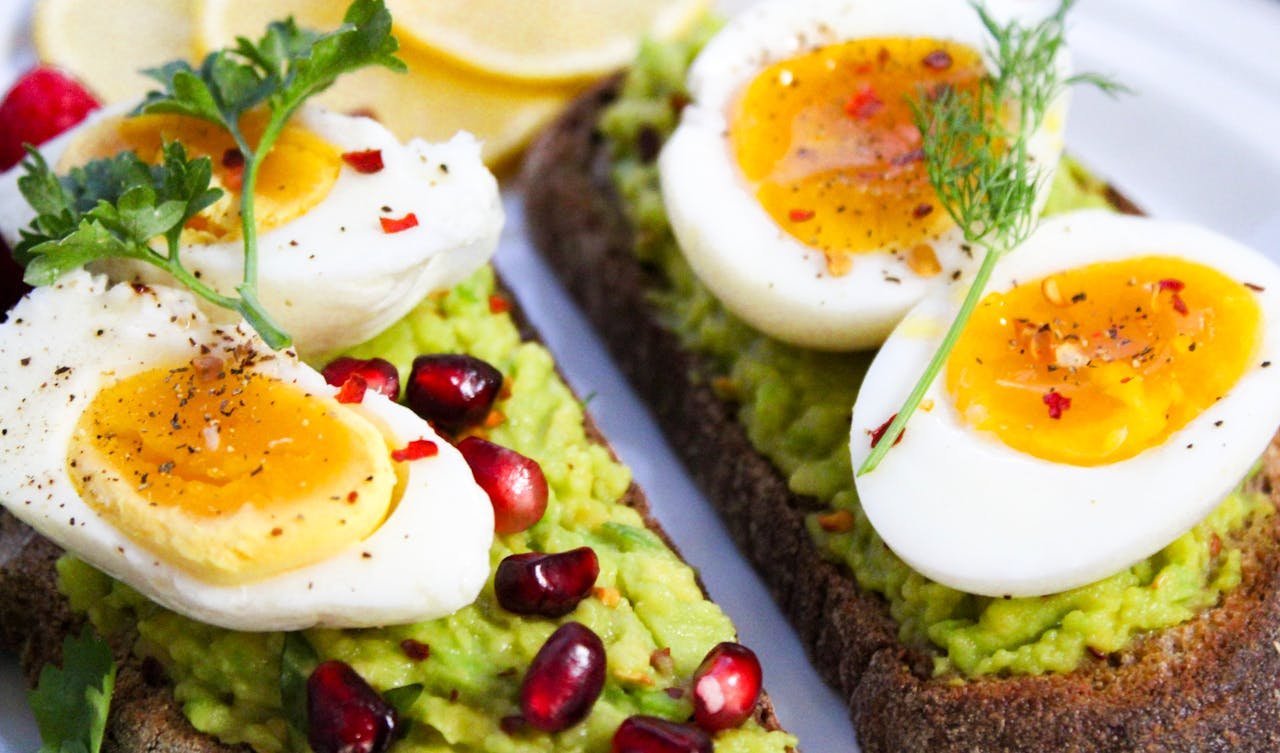 services-06 Savor this delicious avocado toast topped with soft-boiled eggs and garnished with pomegranate seeds.